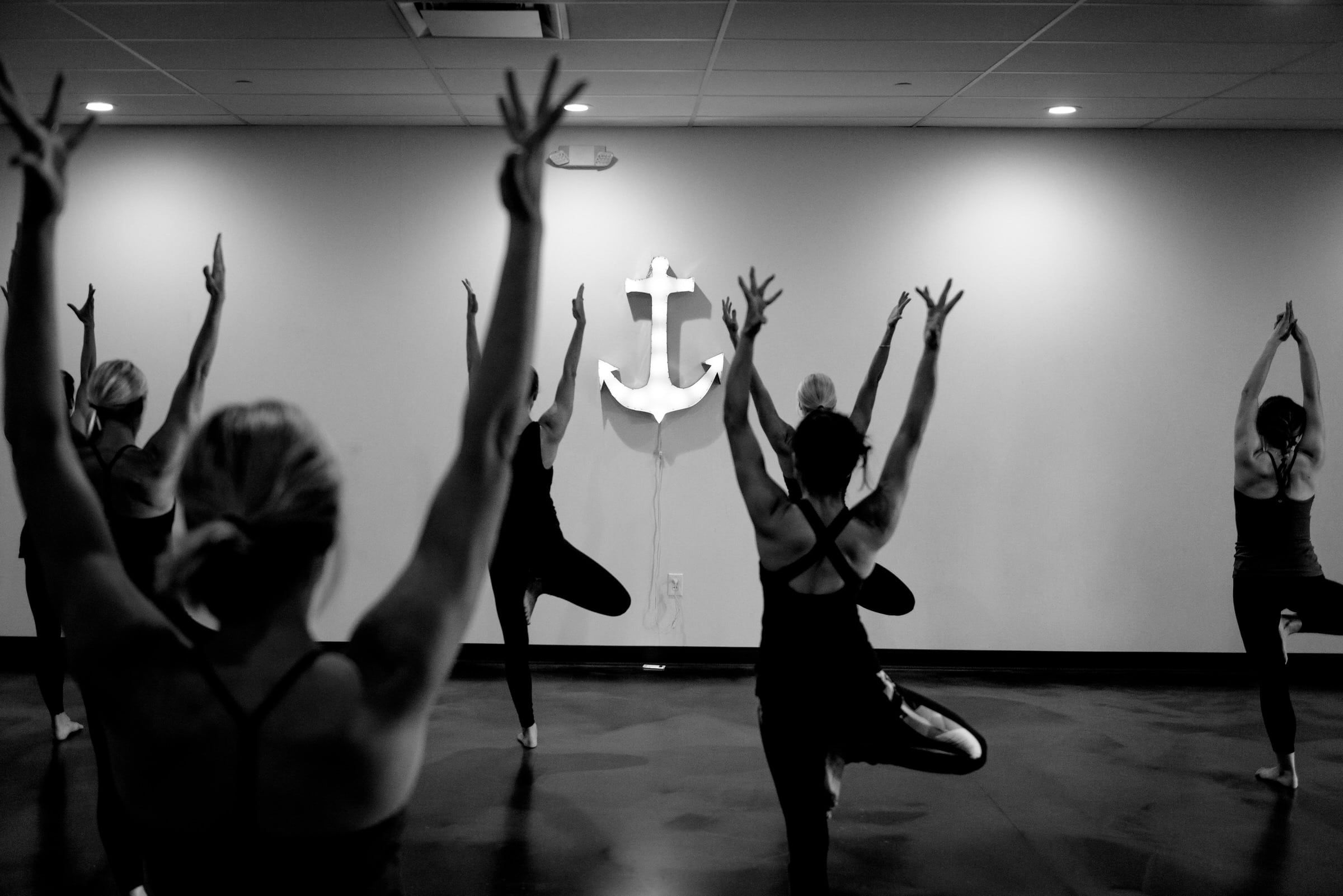 An image of students at Harbor Yoga doing Tree Pose