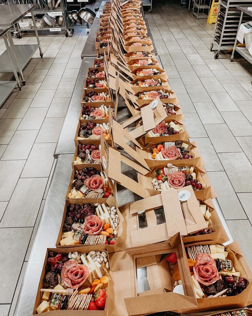A Long Line of Charcuterie Boxes by Boards by Brooke